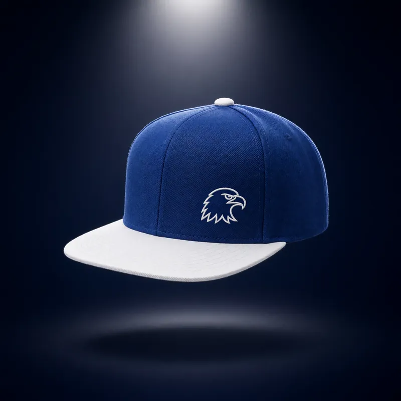 Royal blue snapback with a white flat brim and a small white eagle-head outline